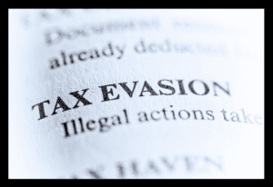 Image of the word "Tax Evasion" in what looks to be a dictionary.