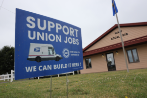 A pro-union sign is seen in front of the United Auto Workers Union building in Oshkosh, Wis., on July 15, 2022