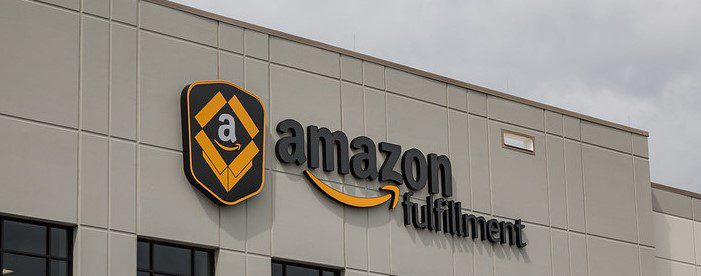 Photo shows the words "Amazon Fulfillment Center" outside one of the company's warehouses.
