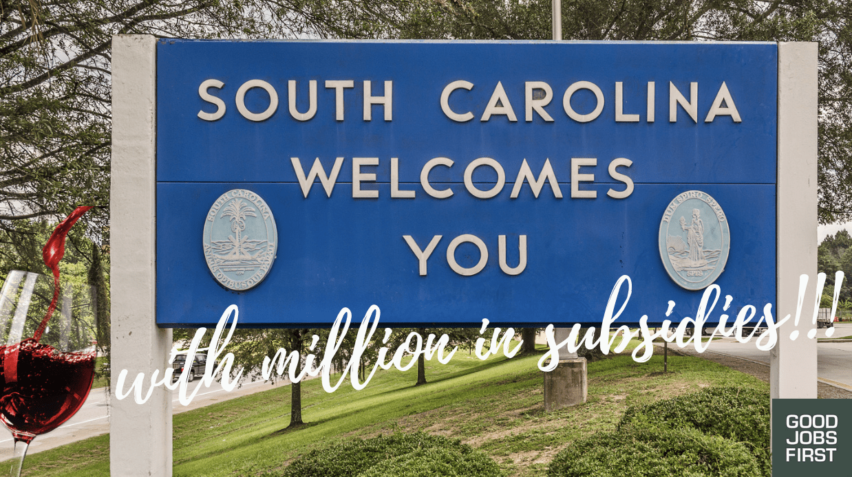 Image of sign that says "South Carolina Welcomes You With Millions in Subsidies" and a glass of wine being poured